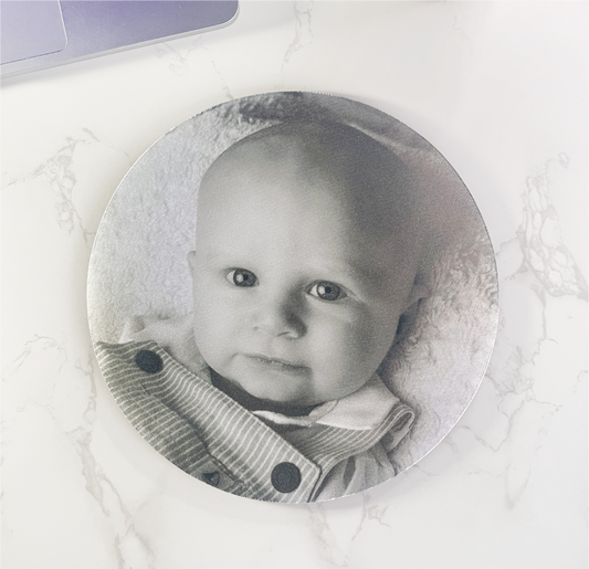 A round fabric mouse mat printed with a photo of your choice